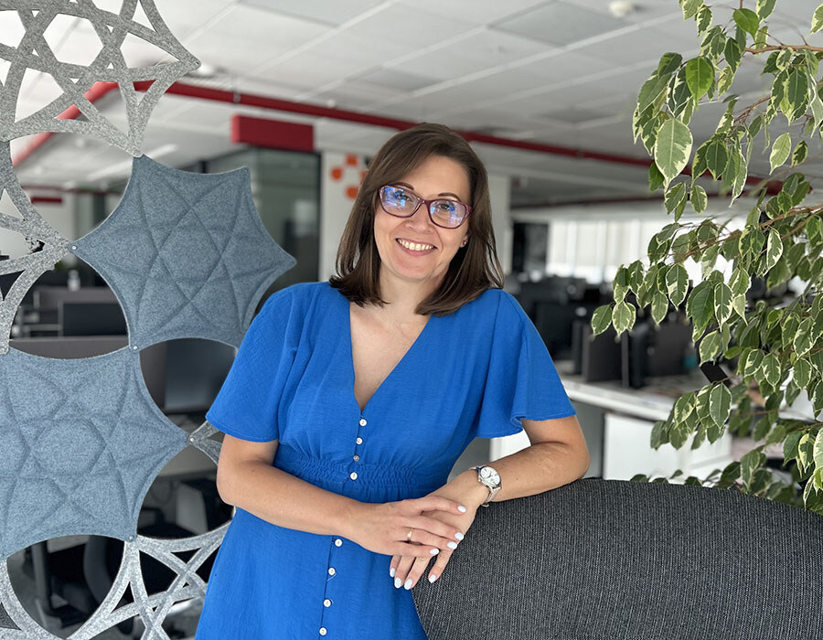 photo of product manager daniela efros leaning against office chair