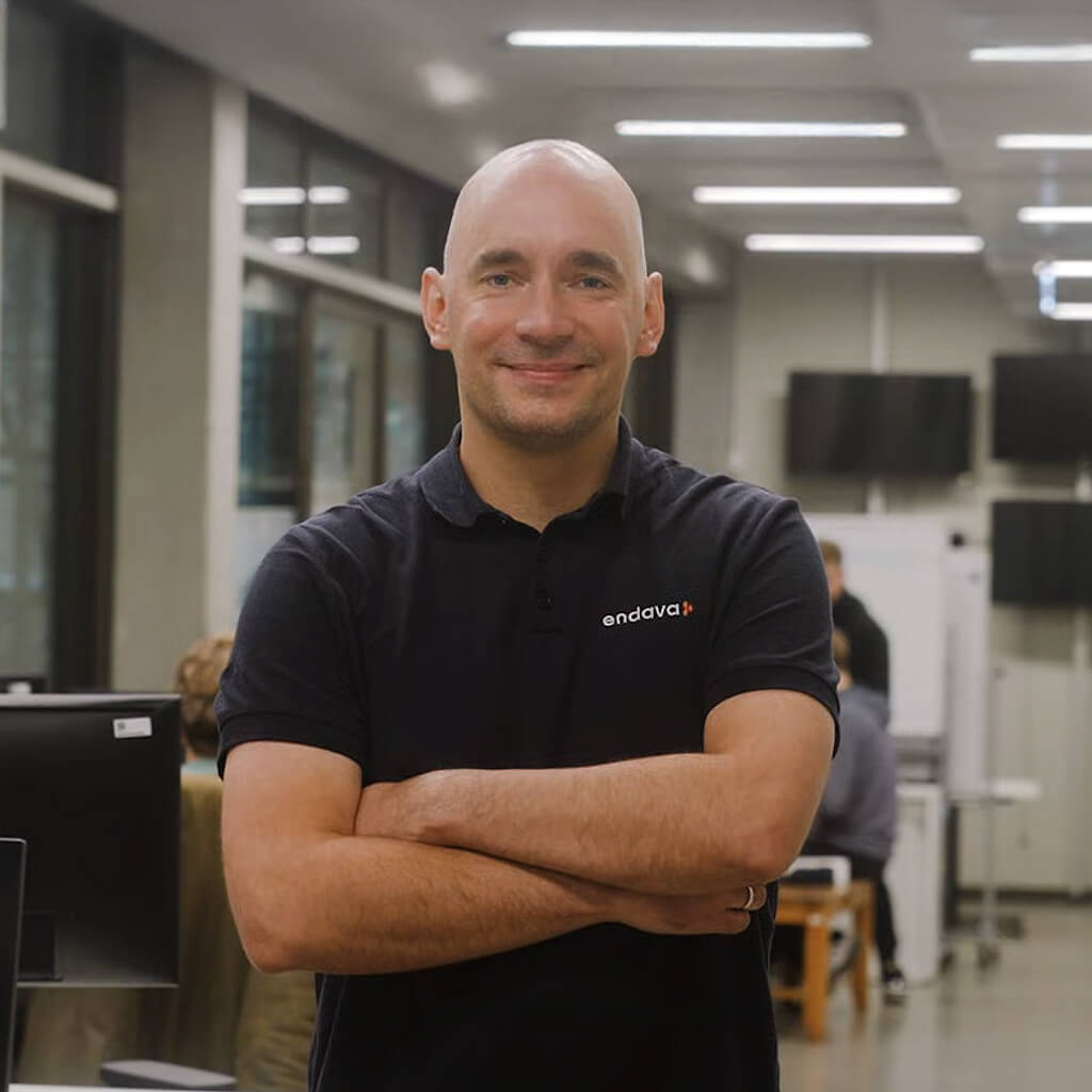 Jan Schuetze standing in Berlin Endava office