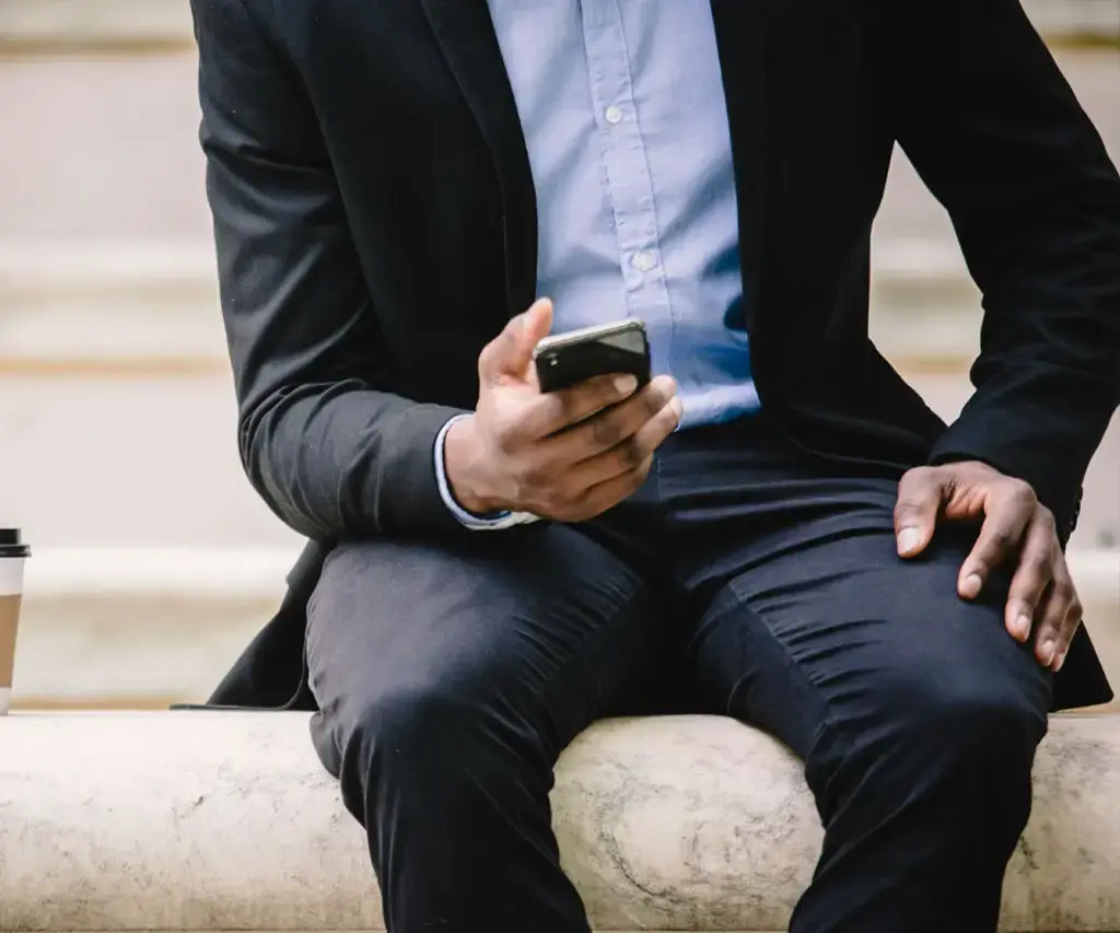 business person holding mobile phone with embedded technology