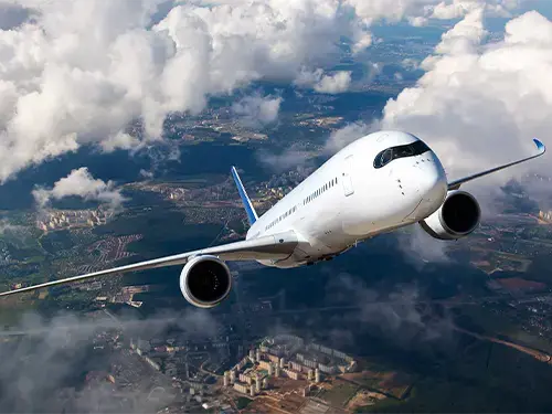 airplane flying in the clouds 