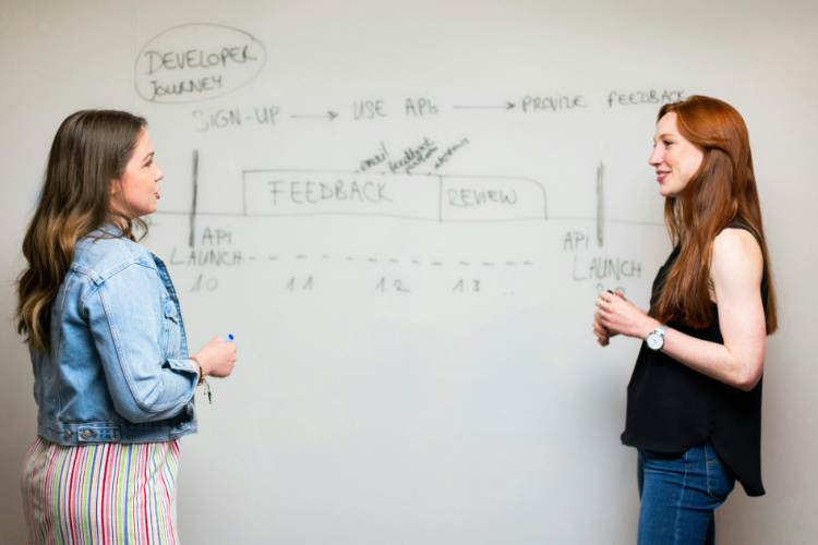 two girls talking in front of each other