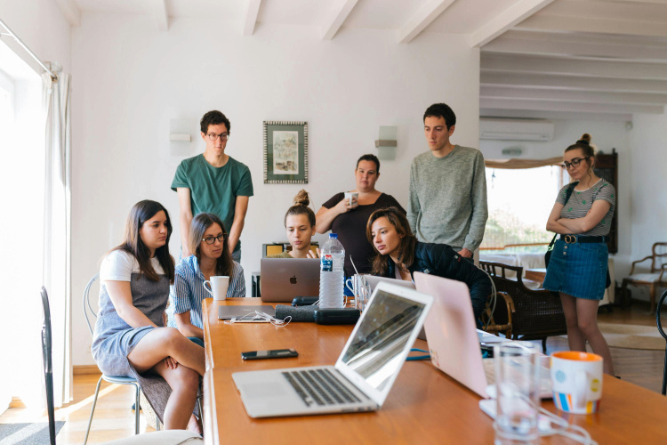 A group of people in a meeting in the office