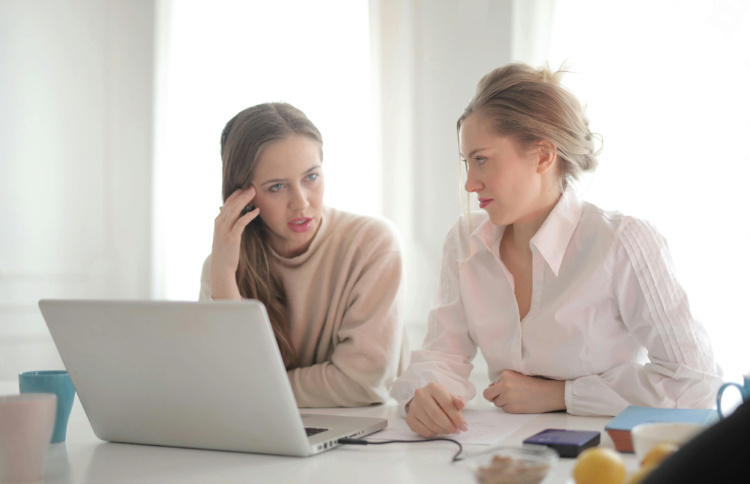 Two women talking at the table