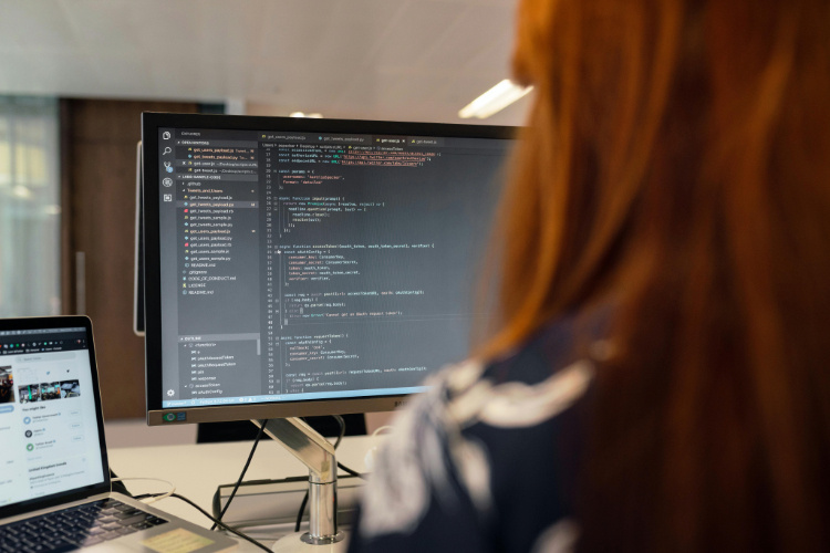 A woman working on a code