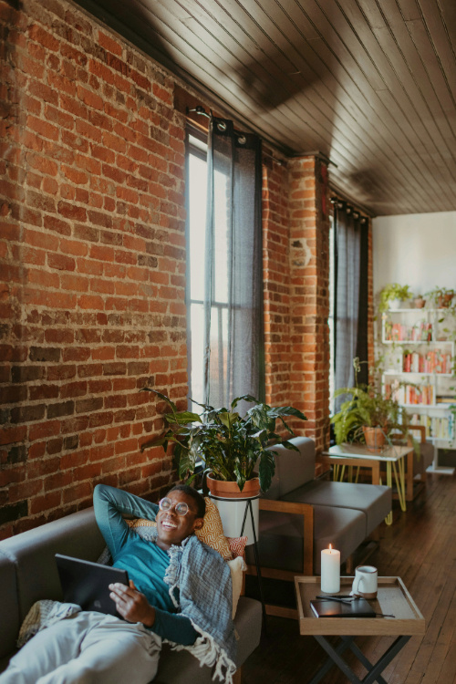 A man relaxing on a sofa