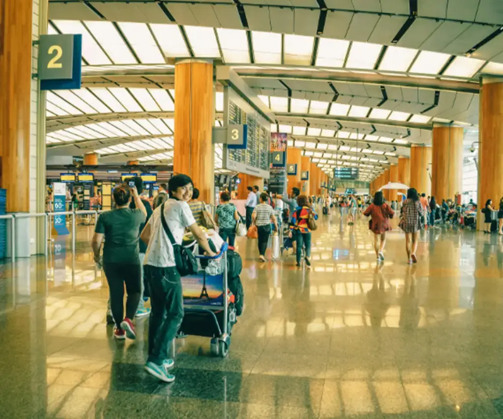 Airport travelers with luggage