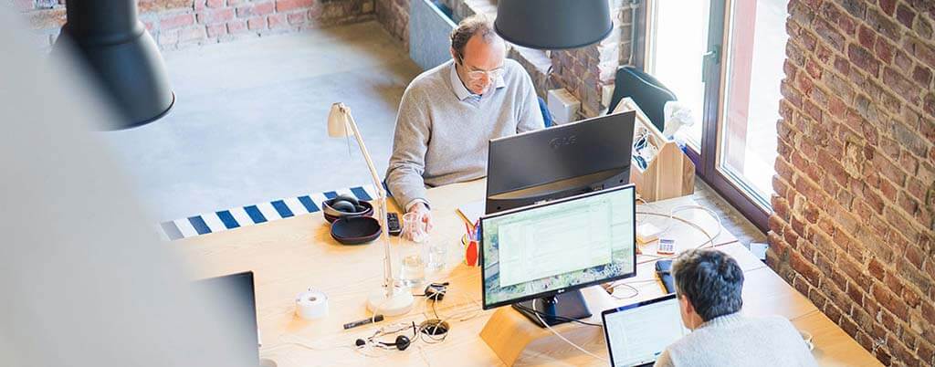 tech employees working on computers using google cloud platform