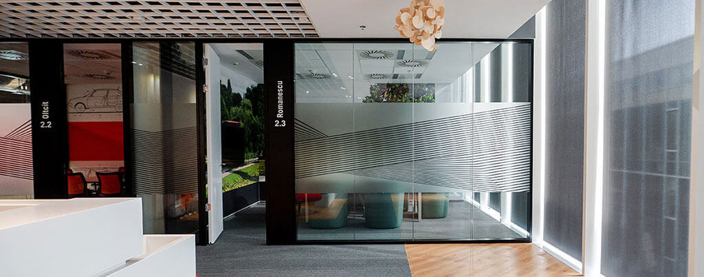 office with glass divider and white steps