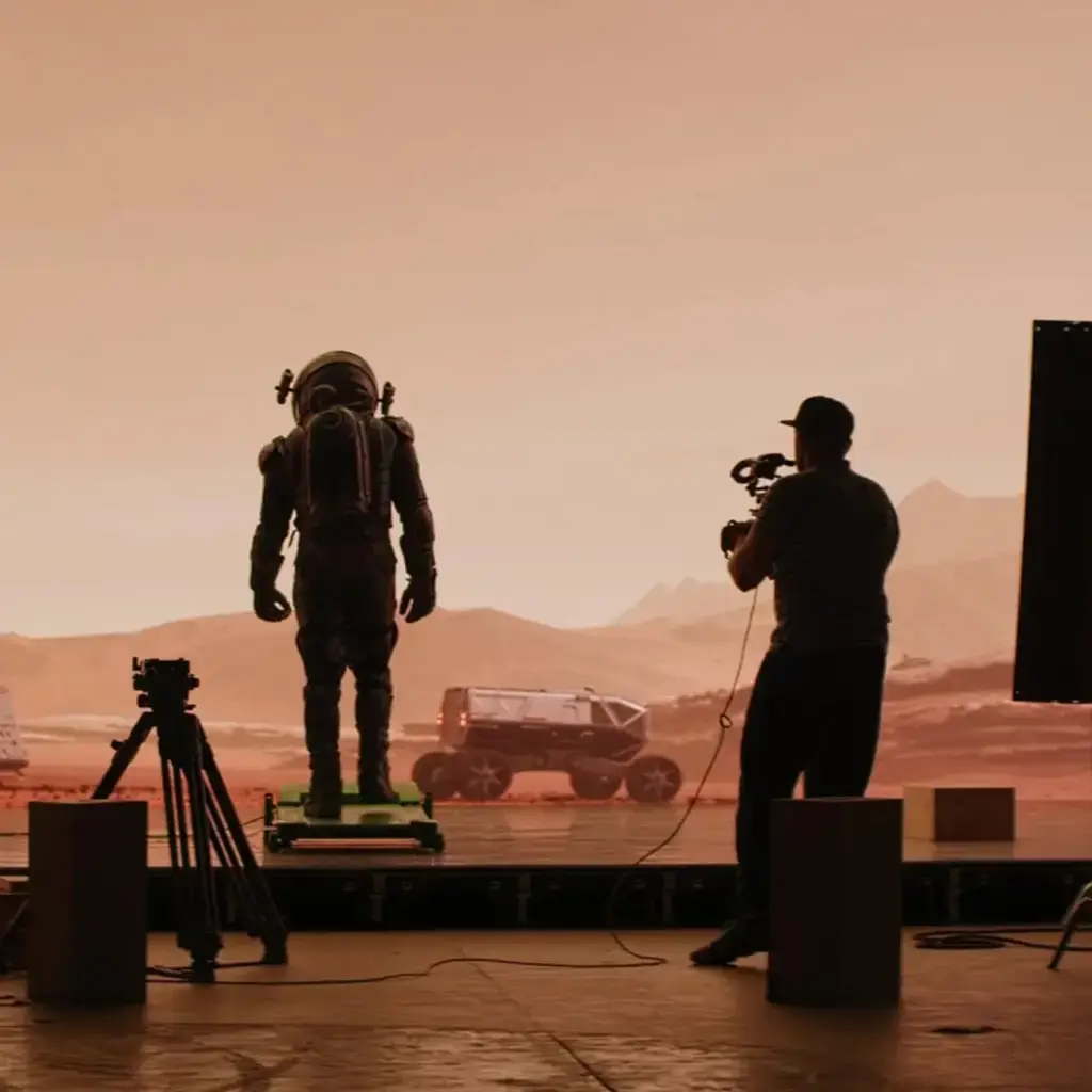 Film set with a futuristic astronaut figure and Mars-like landscape, symbolizing innovation and advanced technology