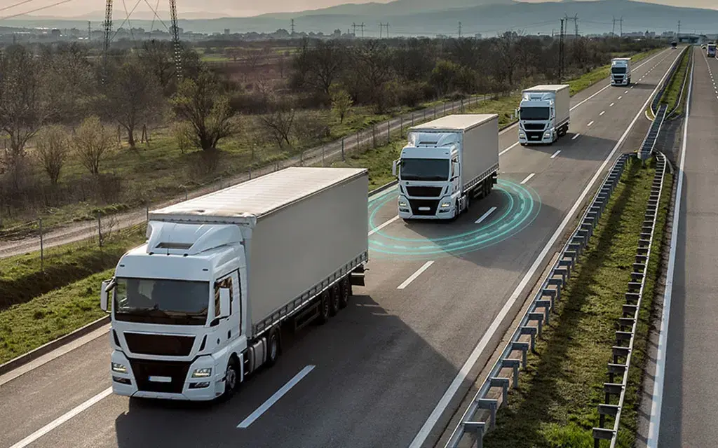 fleet of trucks with advanced technologies traveling on highway