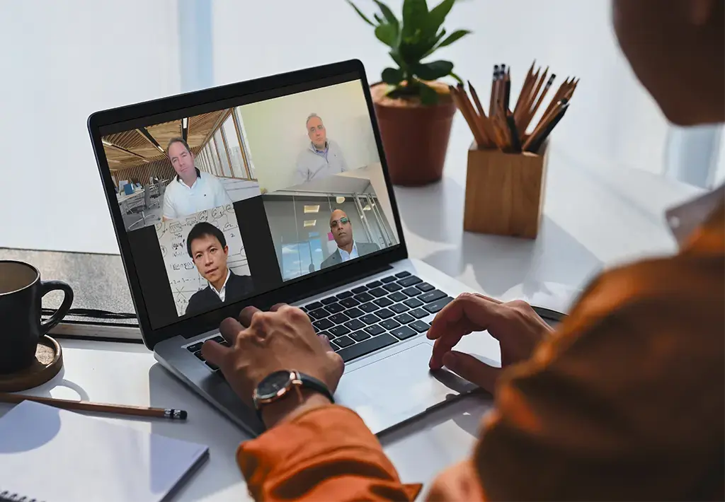 person watching webinar on their laptop