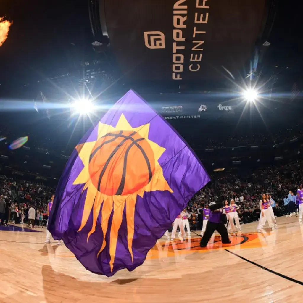 suns basketball team flag in center with cheer team on center court