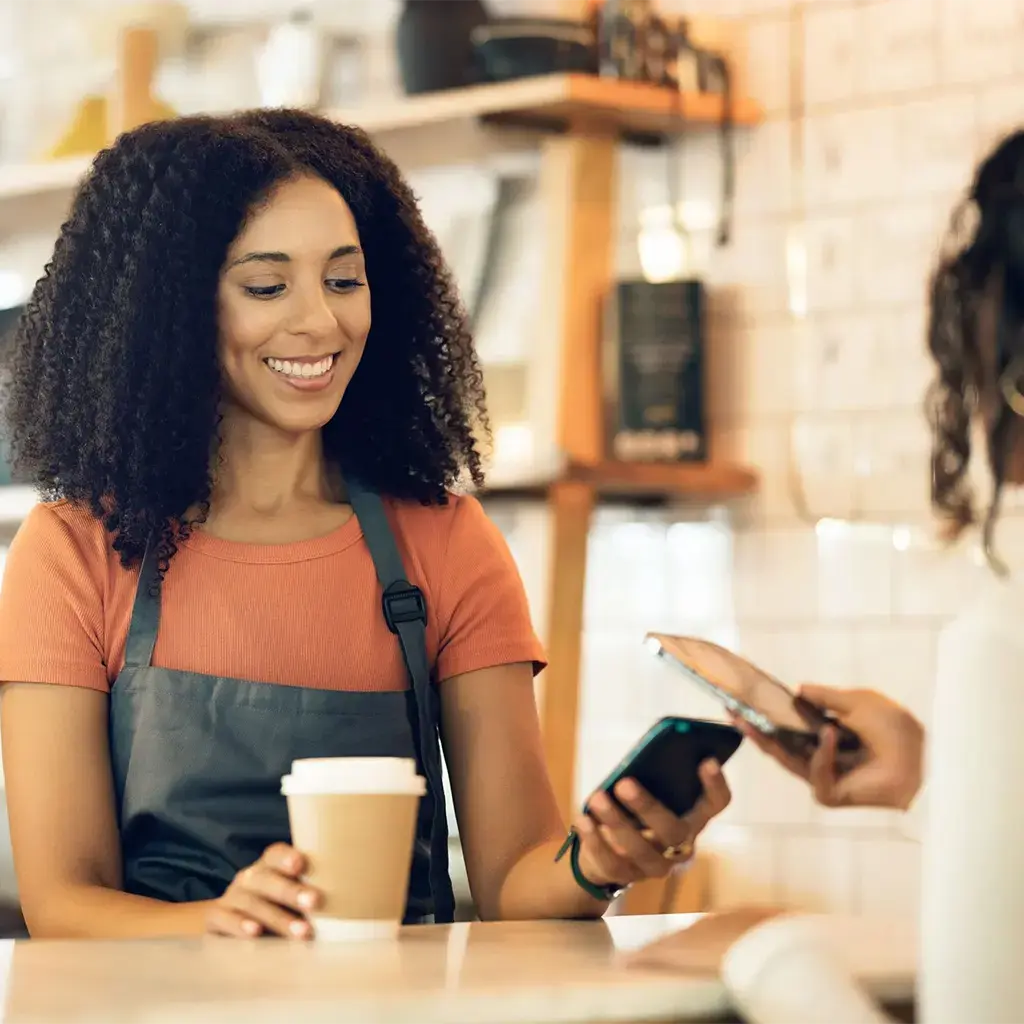 employee collecting store payment for purchases