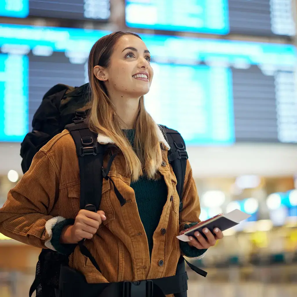 Woman wearing backpack in airport