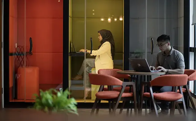 a womanworking in yellow booth in an Endava office