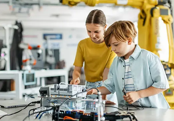 boy and girl working on circuitry