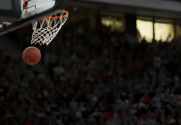 basketball traveling through basketball hoop