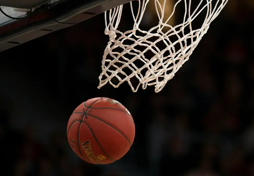 basketball traveling through the hoop's net