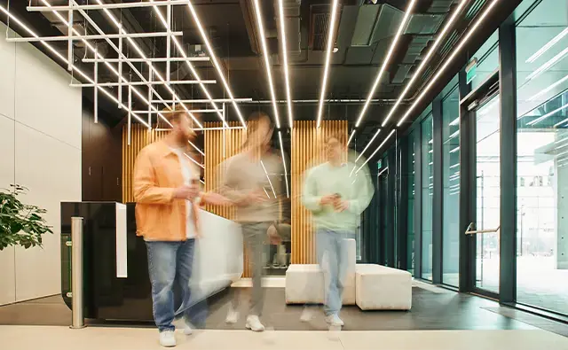 three male coworkers walking blur