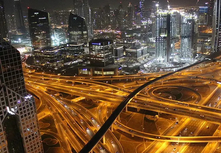 highway and building lights at night in busy city