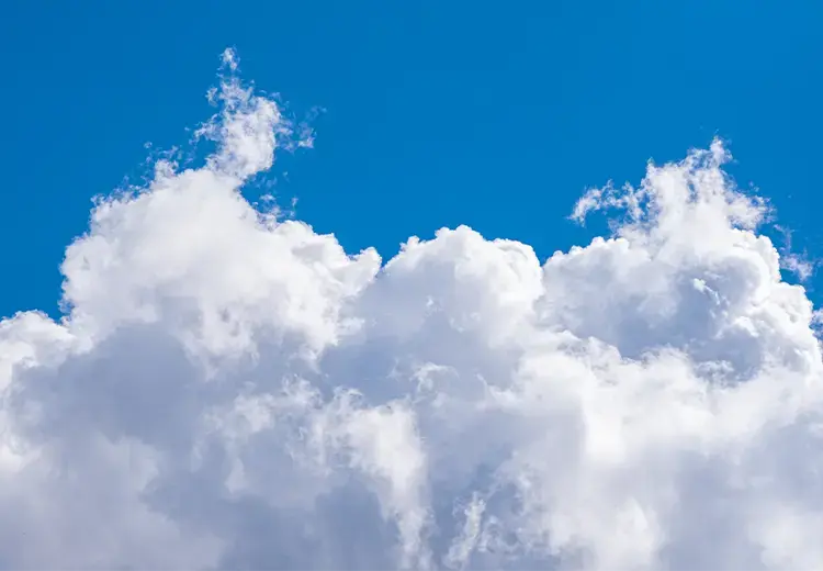 blue sky with white wispy clouds