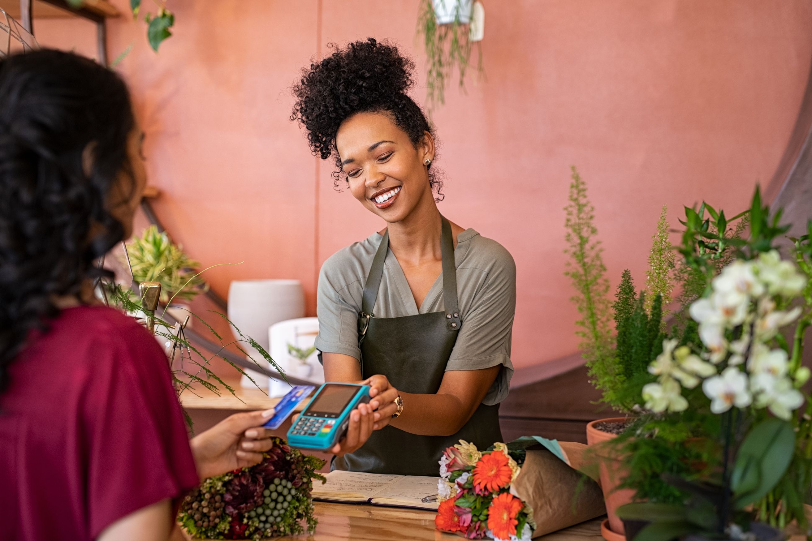 Woman charging customer