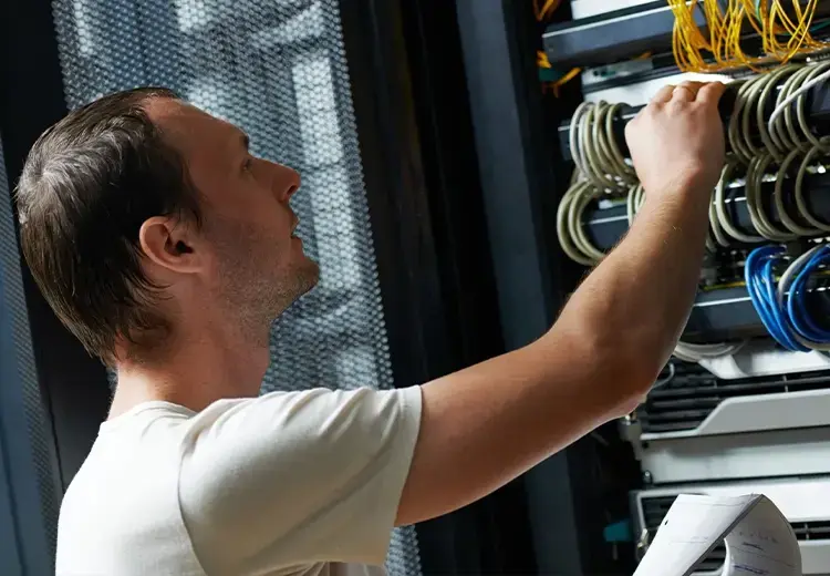 man working with communication wires