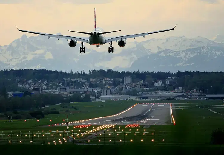 An airplane landing at mountain area airport.