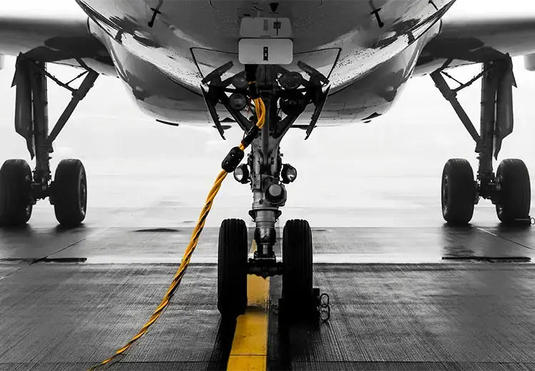 view under airplane fueling on pavement