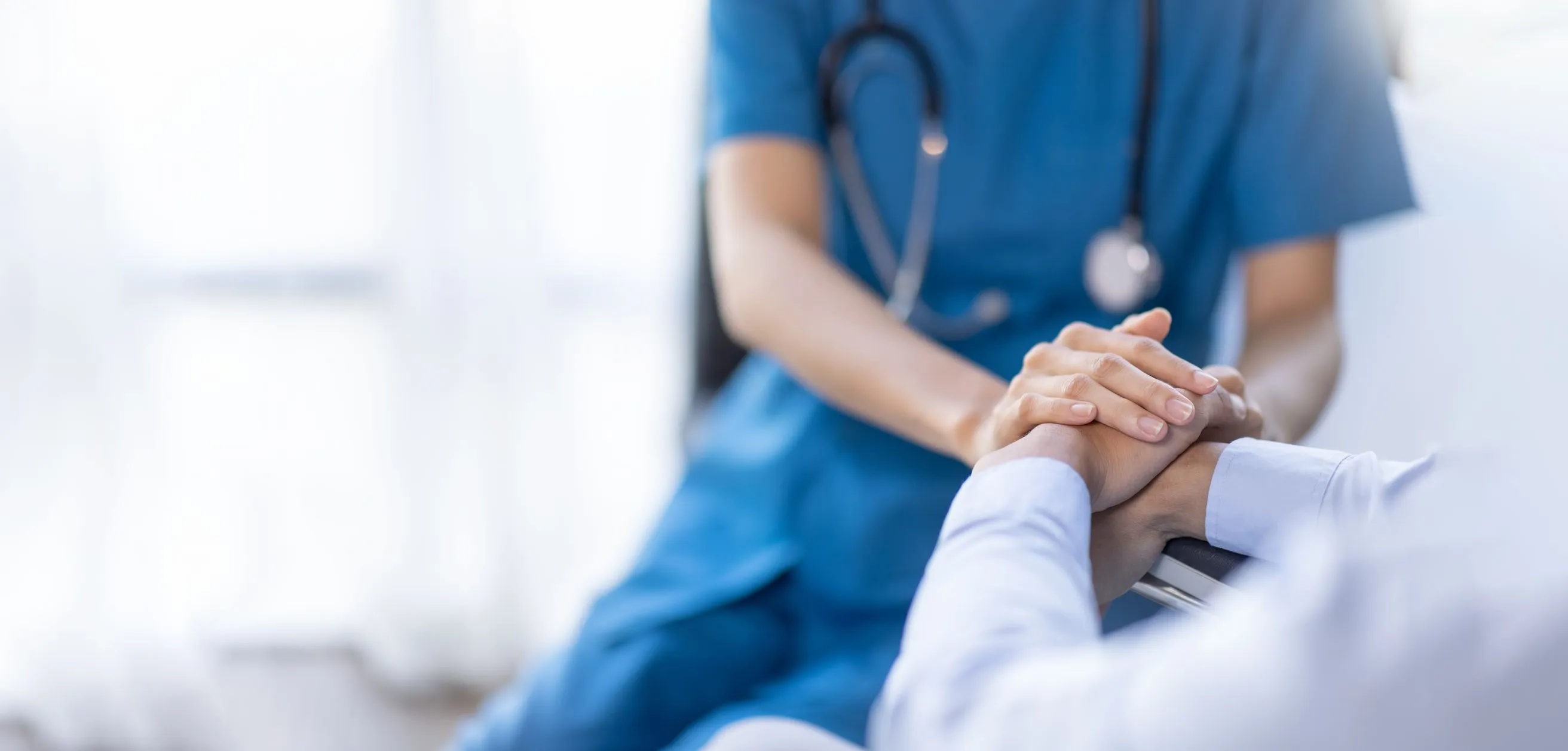 A medical professional is assisting a patient.